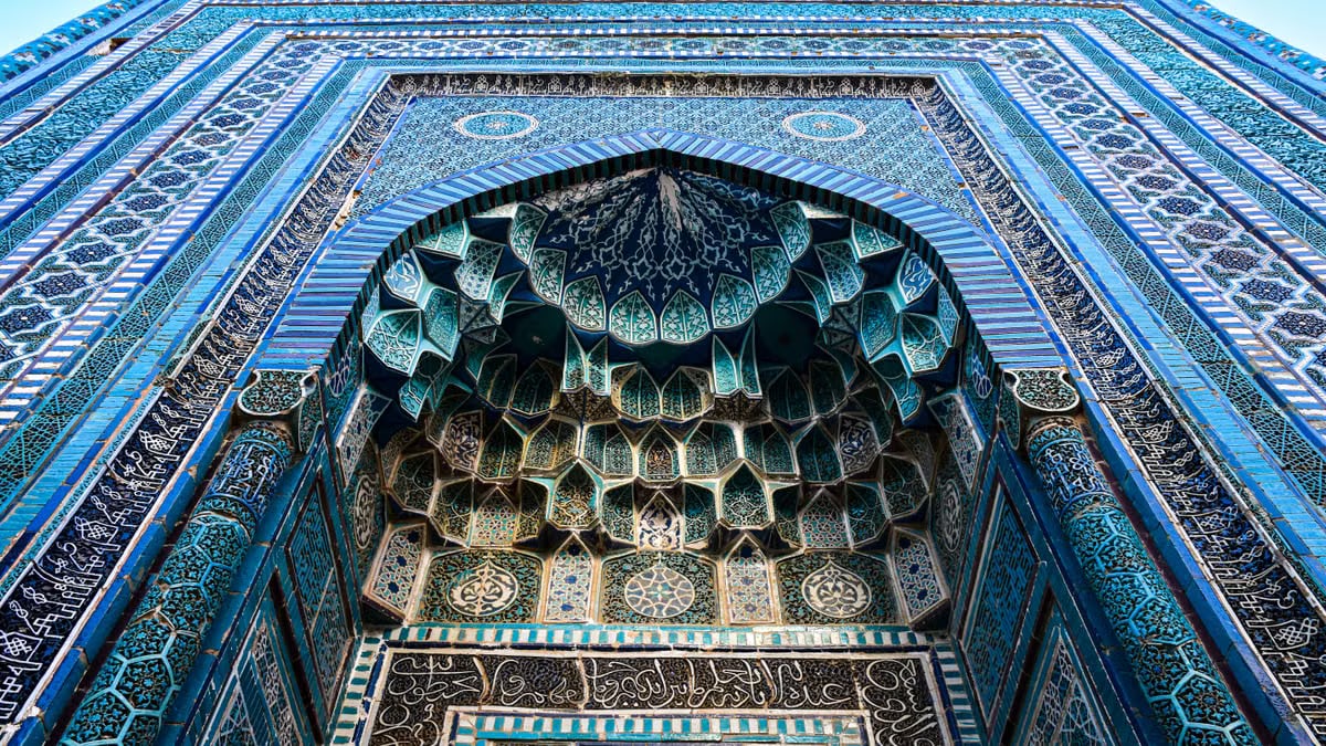 Detailed architectural tile work at Shah-i-Zinda in Samarkand, showcasing Islamic artistry.